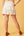 Smocked Ruffle Tiered Mini Skirt- Off White